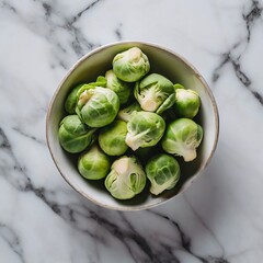 Top view of a brussels sprouts in a solid white marble background; copy space