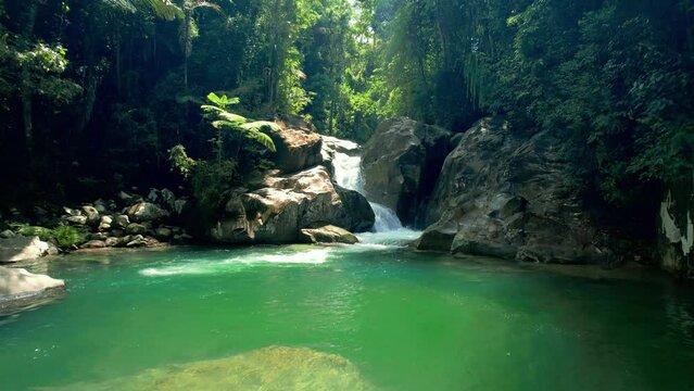 Establish Aerial view Lubuak Ngalauan Waterfall or known as Sarasah Lubuak Rantiang is located in the Bangek River area, Balai Gadang Village, Koto Tangah District, Padang City.