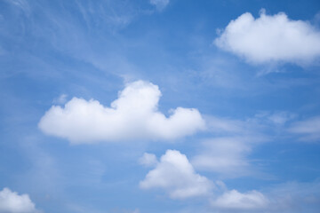 Naklejka na ściany i meble Sky background with white clouds on a bright day