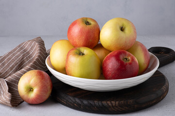 Beautiful ripe apples on a plate. Selective focus.