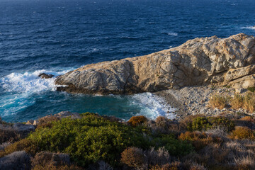 Beautiful cove near Nanouras with beach and rocky coast on the North Aegean island of Ikaria. 