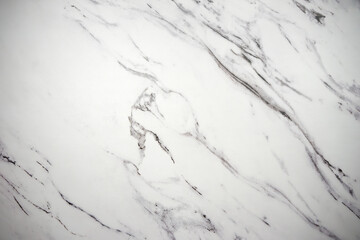 A high-quality photo of the texture of white marble tiles on the wall.White marble countertop.