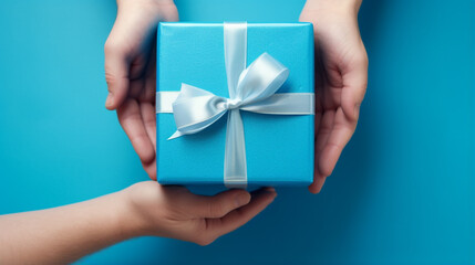 a father receives a gift box with a bow from the hands of his children in close-up. Generative AI
