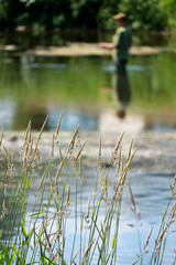 fisherman on the river Semois in Belgium