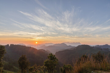 Naklejka na ściany i meble mountain peaks in morning over thailand mountains with sunrise sky background