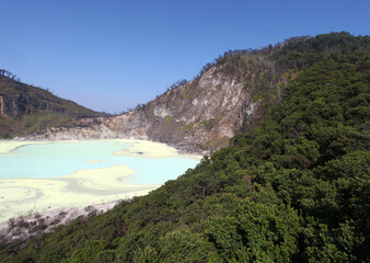 Fototapeta na wymiar White Crater or Kawah Putih, a volcanic sulfur crater lake in a caldera in Ciwidey, West Java, Indonesia.