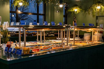 Elegant Buffet Spread with Various Dishes and Labels in hotel - obrazy, fototapety, plakaty