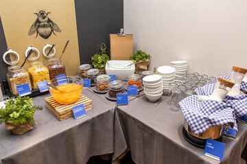 Luxurious Breakfast Buffet Setup with Assorted Cereals and Fresh Canned Fruit Mix in hotel