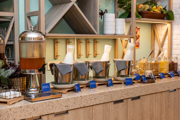Lavish Catering Spread with Juices, Cereals, and Dairy Options in a Modern Buffet Setting in hotel