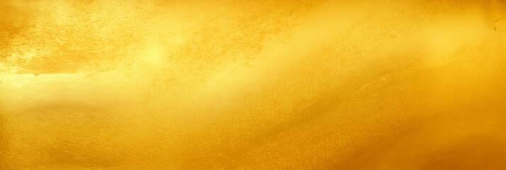 Golden background. Gold texture. Shiny golden wall texture. Beatiful luxury and elegant gold wallpaper