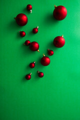 Red Ornaments Christmas decorations on green background