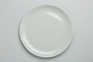 Beautiful ceramic plate on light background, top view