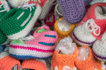Colorful wool knitted socks for children handmade for the cold season. Things made of natural yarn....