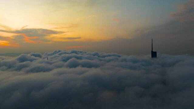 KL Skyscrappers looks majestic from an aerial view during the morning low cloud hours.	