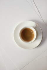 Freshly Made Espresso Top View on White Paper Background. Coffee Refreshment.