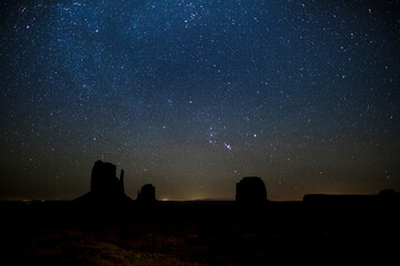 constellation orion rising above Monument Valley, West Mitten Butte, East Mitten Butte and Merrick Butte, Arizona, Utah, USA, travel usa and north america