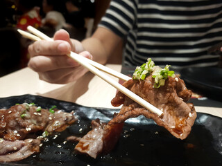 Wagyu beef sushi Chop with chopsticks in a Japanese-style restaurant