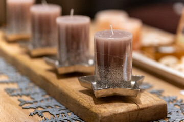 decorative candles on a wooden table