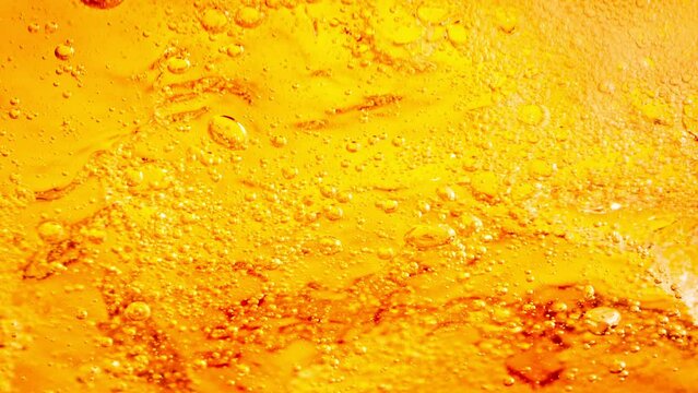 Super Slow Motion Detail Shot of Bubbling Lemonade Abstract Background at 1000fps.