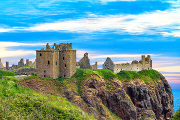 Dunnottar Castle is a ruined medieval fortress located upon a rocky headland on the north-eastern...
