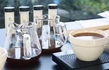 Glass erlenmeyer flask coffee mug in research laboratory.