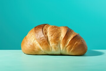 baked loaf of bread against vivid blue background