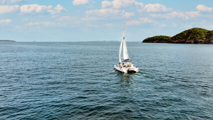 Aerial view of a catamaran on the andaman seas. Sailing in Phuket, Thailand.