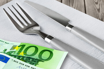 Cutlery with Euro Banknotes and table napkin