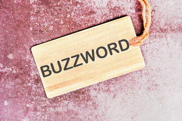 Buzzword word written on a card with a rope on an abstract background