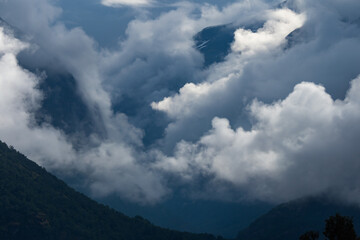 Clouds rolling in above fhord in Norway during summer