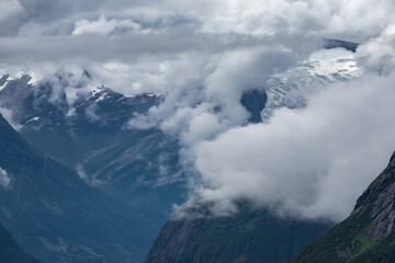 Glacier fed river flowing through the forest of Norway during summertime