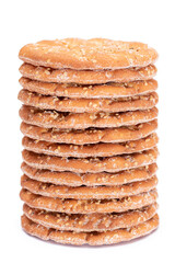 A Stack of Round Salt Crackers with Sesame Isolated on White Background. Dry Snacks - Isolation