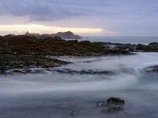 Rocky sea beach at dusk