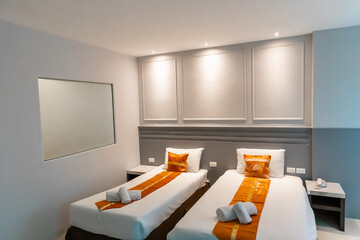 Hotel Room Decorated single double bedroom with nice white bed sheets purple decorative colours....