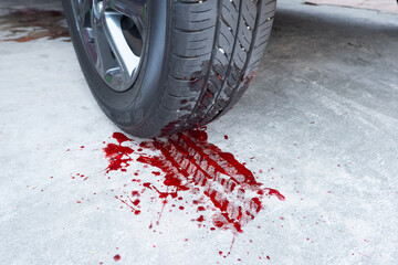 car tire tracks of red blood. concept illustration of a murder, hit and run, or car vehicle accident