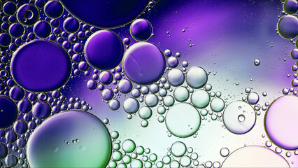 Abstract Colorful Food Oil Drops Bubbles and spheres Flowing on Water Surface