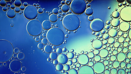 Abstract Colorful Food Oil Drops Bubbles and spheres Flowing on Water Surface