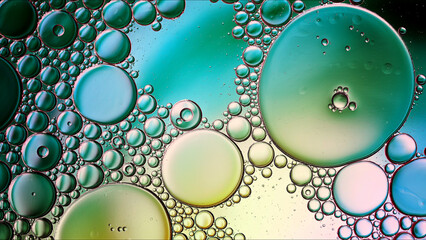 Abstract Colorful Food Oil Drops Bubbles and spheres Flowing on Water Surface