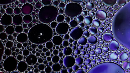 Abstract Colorful Food Oil Drops Bubbles and spheres Flowing on Water Surface