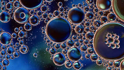 Abstract Colorful Food Oil Drops Bubbles and spheres Flowing on Water Surface - 687485109