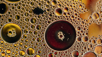 Abstract Colorful Food Oil Drops Bubbles and spheres Flowing on Water Surface - 687485164