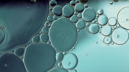 Abstract Colorful Food Oil Drops Bubbles and spheres Flowing on Water Surface - 687485171