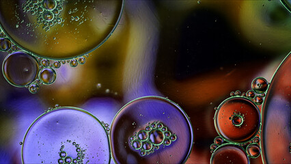 Abstract Colorful Food Oil Drops Bubbles and spheres Flowing on Water Surface - 687485355