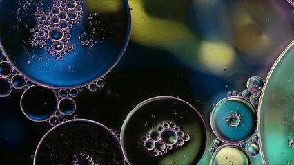 Abstract Colorful Food Oil Drops Bubbles and spheres Flowing on Water Surface - 687485367