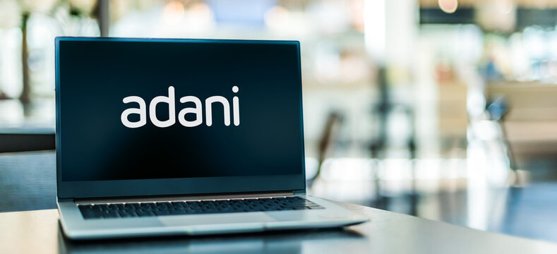 Laptop computer displaying logo of Adani Group