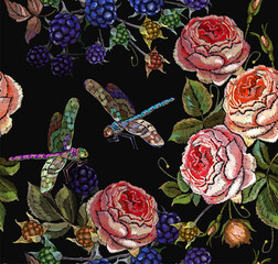 Embroidery pink roses, forest berries and colorful dragonflies. Seamless pattern. Beautiful bouquet of flowers. Summer garden art. Fashionable spring template for design of clothes