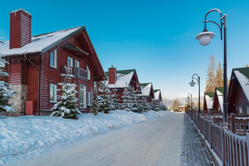 Street with row of winter chalet on the ski resort.