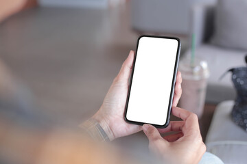 cell phone blank white screen mockup.hand holding texting using mobile on desk at office.background empty space for advertise.work people contact marketing business,technology