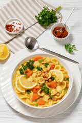 orecchiette pasta chickpea soup in white bowl