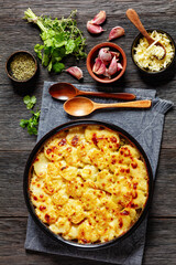 au gratin potatoes with diced ham and green peas